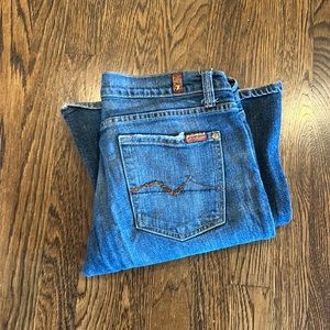 Sz 31 Seven brand jeans. Rhinestone design on pockets. Bootcut and dark wash.